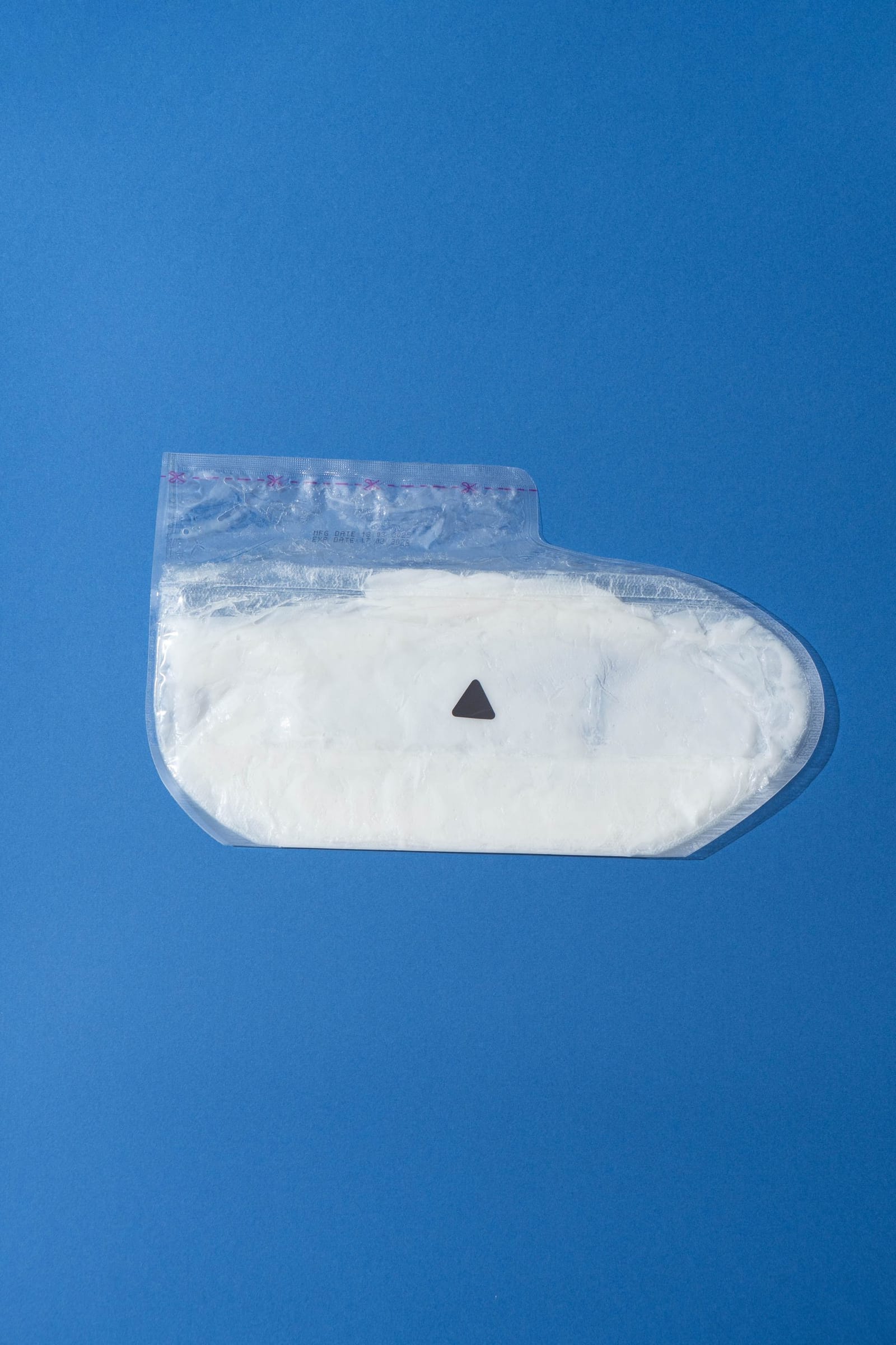 A single bootie-shaped paraffin beauty wax foot mask in its sealed pack