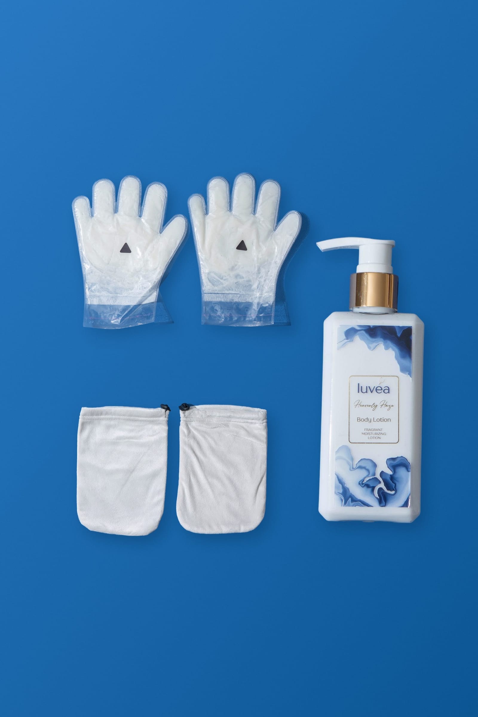The Hand Ritual with cream: paraffin beauty wax hand masks, terry cloth covers and a bottle of Heavenly Haze body lotion