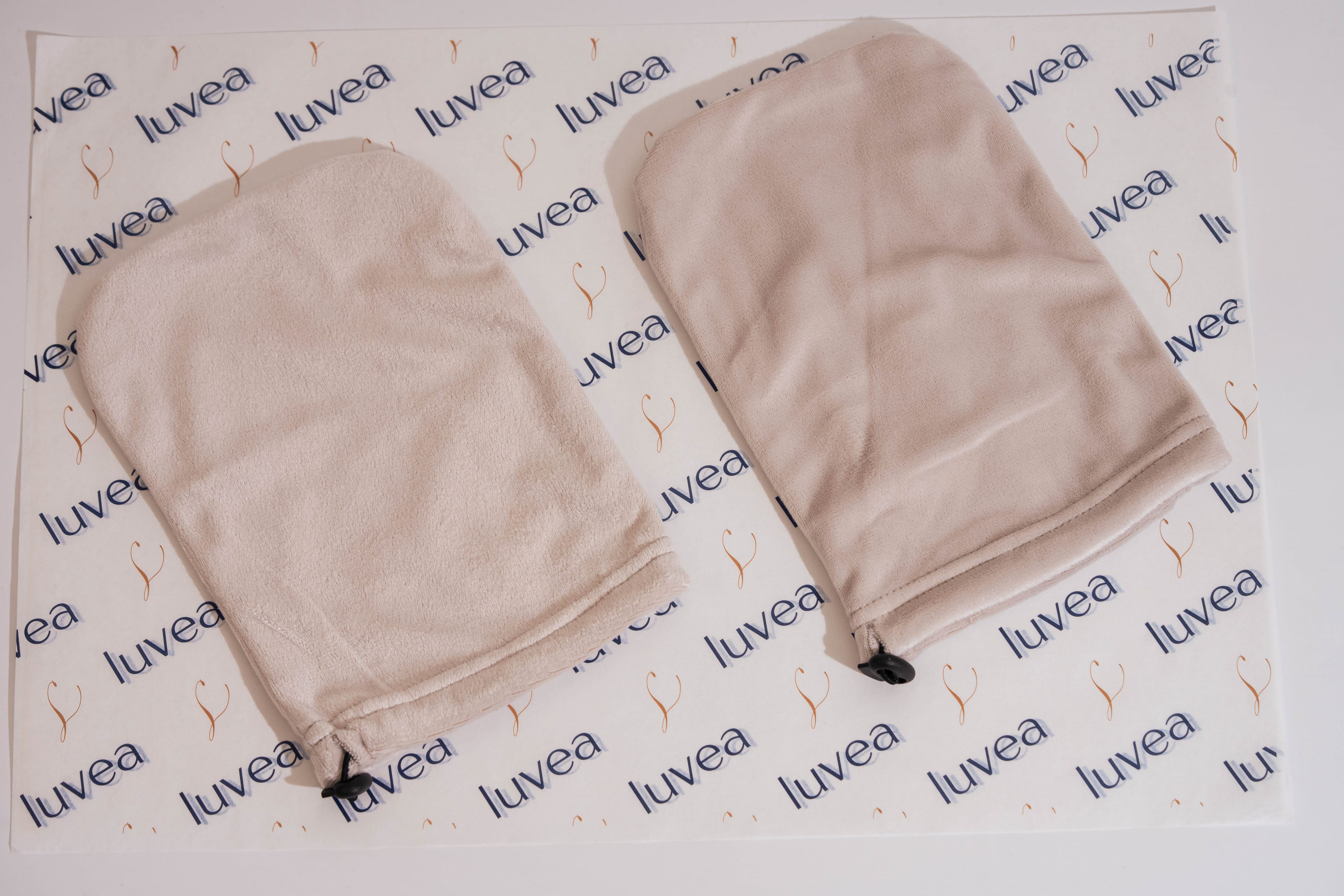 Navy terry cloth glove covers from the Hand Ritual laid flat